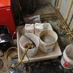 Adding antifreeze to a hot water boiler system.